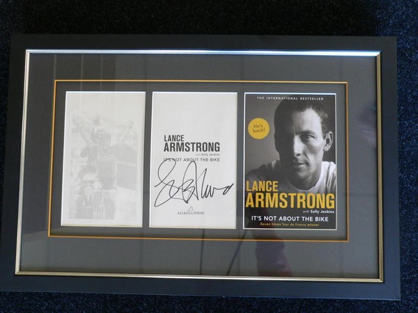 The Lance Armstrong signed and framed collectors item coming up for auction at Remarkables Primary School's Glittering Peaks evening
